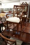 A set of eight mahogany dining chairs, two with arms.
