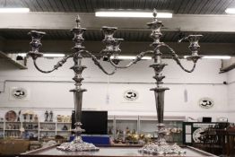 A good pair of plated three light candelabra.