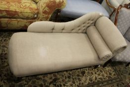 A Victorian style miniature chaise longue.
