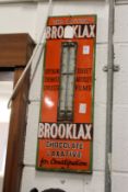 Brooklax, an enamel advertising sign with thermometer (lacking tube).