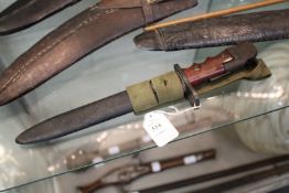 A British Army Land Service bayonet No. 7, Mark 1/L, with webbing frog.