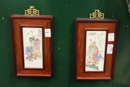 A pair of small Chinese porcelain plaques, framed.