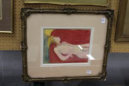 Reclining female nude in a classical decorative gilt frame. Colour print.