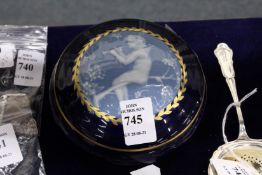 A porcelain powder bowl and cover with pate sur pate style cover.