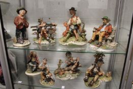 A quantity of Capodimonte figures.