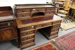 A good Victorian carved oak kneehole desk.