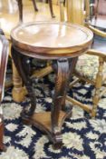 A good 19th century carved mahogany pedestal with circular top, supported on three well carved
