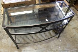 A modern metal and glass console table.