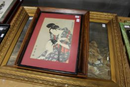 A large colour print of a lion and lioness and two other items.