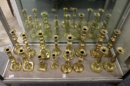 Various brass candlesticks.