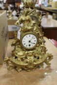 An ornate gilt spelter mantle clock.