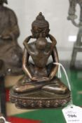 A small bronze erotic couple.