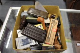 A quantity of cigarette lighters, cigar cutters, cigar cases and other smoking related items.