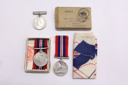 Two WWII medals with ribbons and original box etc.