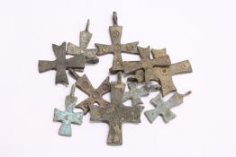 A quantity of small bronze Roman crosses.