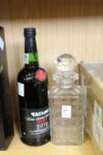 A cut glass decanter and a bottle of Taylor's Late Bottled Vintage Port, 1976.