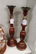 A pair of decorative turned wood candlesticks.
