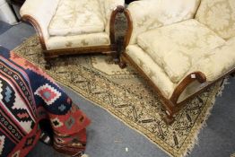 A Persian style cream ground rug.