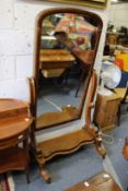 A Victorian mahogany cheval mirror.