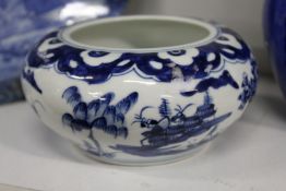 A Chinese blue and white circular bowl.