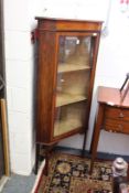 An inlaid mahogany standing corner display cabinet.