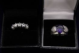 Two decorative silver rings.