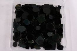 A box of loose coloured stones.
