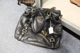 A ladies' black leather handbag.