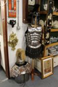 Various items of Roman re-enactment armour, to include two breast plates, two helmets and a sword.