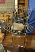 In the manner of Harry Bertoia, a wire work chair.
