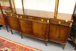 A mahogany breakfront sideboard.