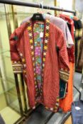 A long embroidered Tekke coat with floral lining.