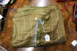 An Indian olive green ground silk shawl.