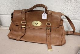 A ladies' brown leather handbag.