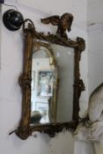 A good decorative 19th century gilt framed mirror with eagle cresting.