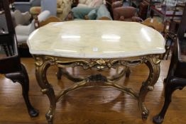 A marble top giltwood coffee table.