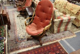 A large Persian design carpet, cream ground with floral decoration.