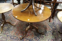 A 19th century oak circular tilt top tripod table.