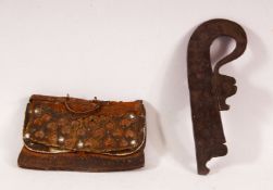 AN INDO PERSIAN LEATHER FLINT POUCH WITH STRIKER, together with another Indo Persian flint