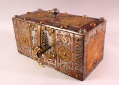 A FINE NORTH AFRICAN TUAREG STEEL, COPPER AND BRASS BOUND WOODEN CASKET, with pierced and