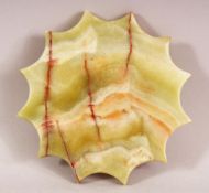 A TURKISH ISLAMIC BEKTASI TILSUMTASI / STONE PANEL, in star form. 13cm