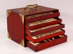 A CHINESE BAMBOO & BONE BOXED MAHJONG SET - comprising 56 drawers full of counters and sticks,