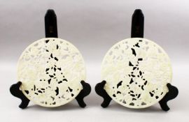 TWO 20TH CENTURY CHINESE CARVED HARDSTONE / JADELIKE BI - DISKS, each disk carved with koi carp