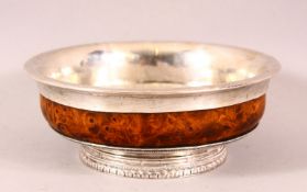 A 19TH CENTURY TIBETAN SILVER & HARDWOOD TEA BOWL / CUP - with silver mounts and a heavy dense
