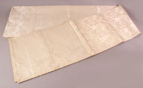 A FINE JAPANESE SILK EMBROIDERED FUKURO OBI TIE - the silk with a white ground depicting phenix