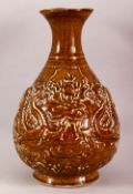 A LARGE CHINESE BROWN GLAZED POTTERY DRAGON VASE, decorated with two dragons either side of the