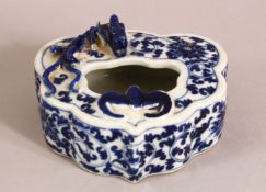 A CHINESE BLUE AND WHITE PORCELAIN BRUSH WASH, with dragon and bat, 11cm x 10cm.