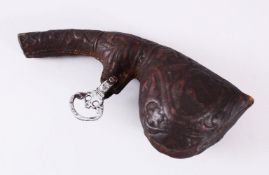 A GOOD 19TH CENTURY PERSIAN LEATHER POWDER FLASK, with embossed decoration of animals, 25cm