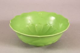 A CHINESE GREEN GLAZED LOTUS FORMED PORCELAIN PETAL DISH - with moulded petal lower section - the
