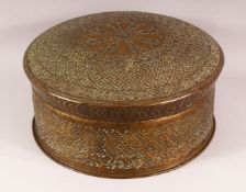 A 19TH CENTURY SIKH PIERCED BRASS TURBAN BOX, the box and cover with profusely pierced and chased